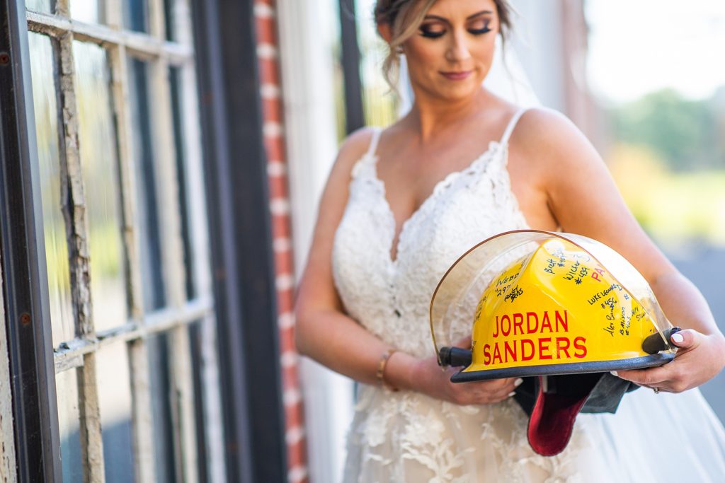 Bride with firefighter helmet in remembrance of her father